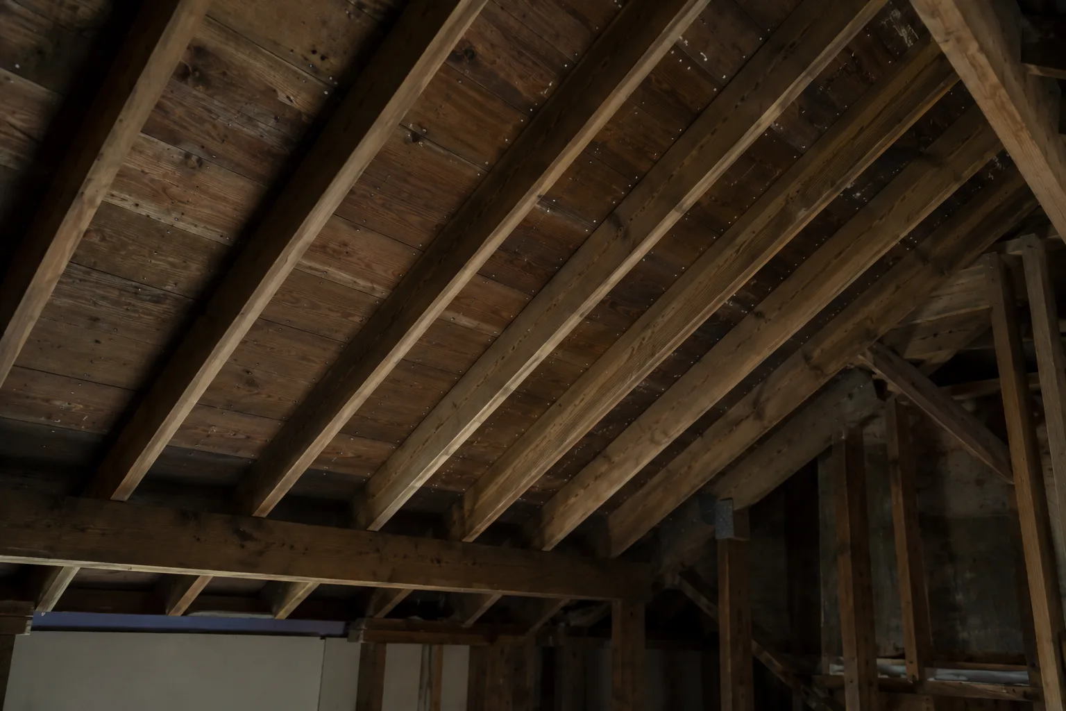 Attic rafters and roof decking seen from below